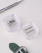 Panerai Strap Tubes in 20mm, 22mm, 24mm & 26mm on a table with a green strap and a spring bar tool