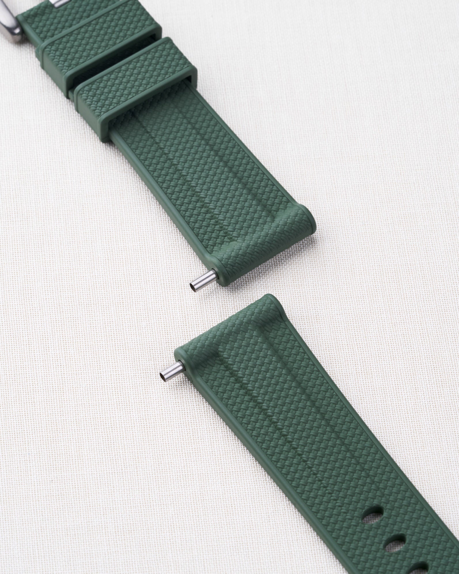 Panerai strap tubes shown in action on a green Panerai strap