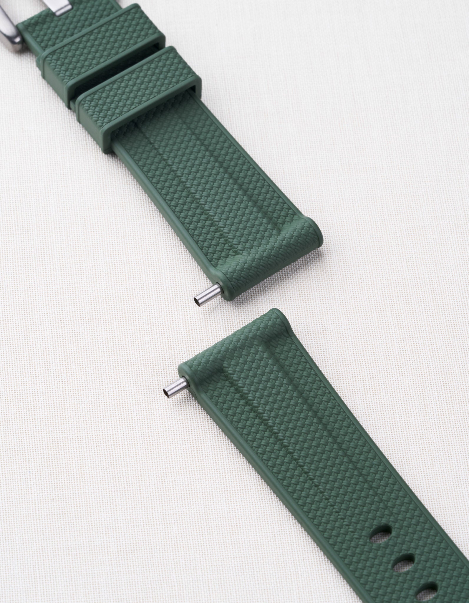 Panerai strap tubes shown in action on a green Panerai strap