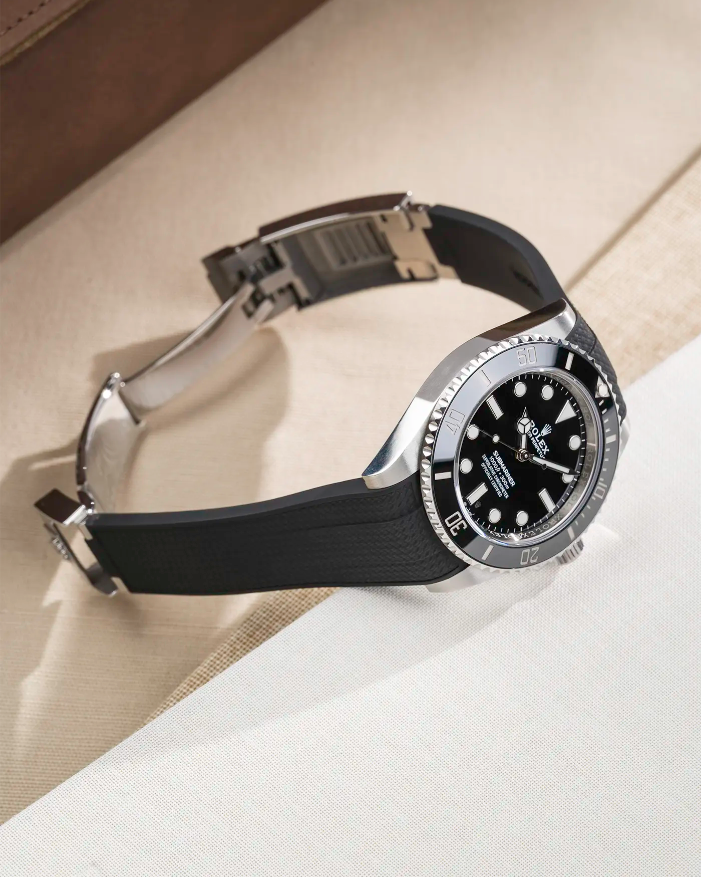 Rolex Submariner 41 with black Vertech FKM Rubber Strap sitting on the watch, integrated with original clasp – product photo side angle with clasp open