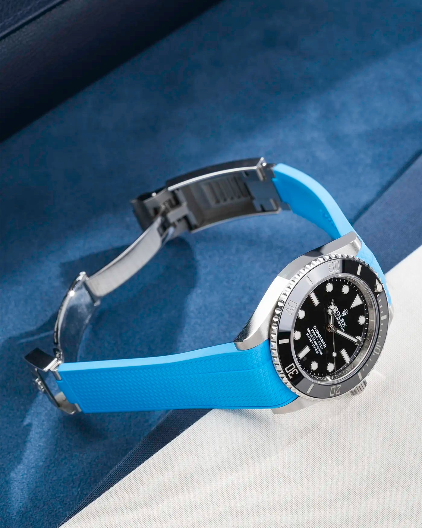 Product image of Rolex Submariner 41 ref. 126610LN/124060LN on Capri Blue Vertech FKM Rubber Strap – clasp open in angled side view