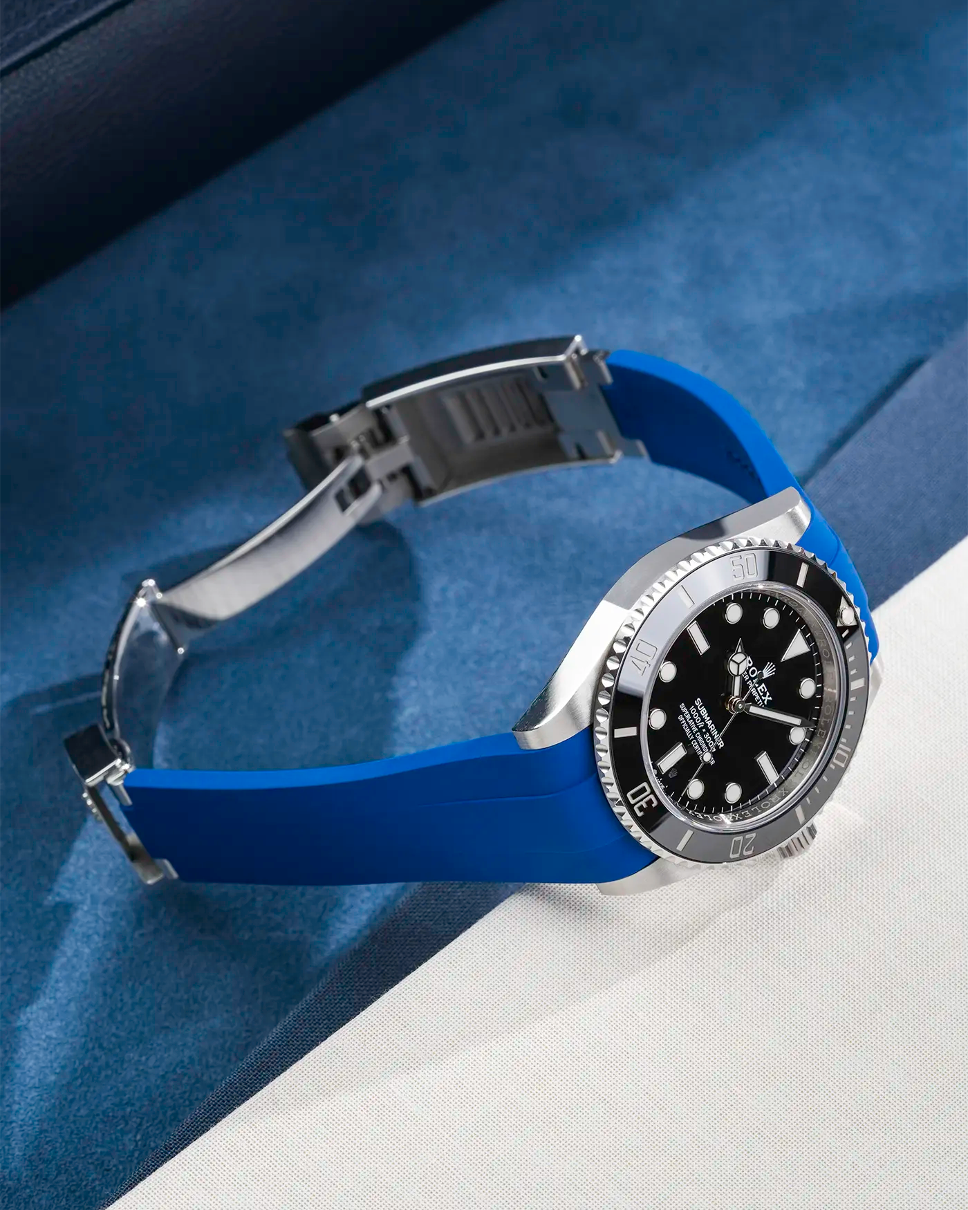 Rolex Submariner 41 with navy blue Classic Smooth FKM Rubber Strap sitting on the watch, integrated with original clasp – product photo side angle with clasp open
