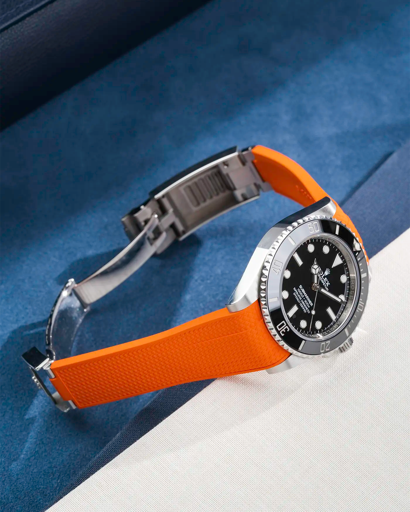 Product image of Rolex Submariner 41 with orange Vertech FKM Rubber Strap fitted on the watch, integrated with original clasp – side view showing clasp open