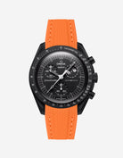 Black Omega X Swatch MoonSwatch Mission to The Moonphase - New Moon with a orange vertech rubber watch strap and a with detailed face on a white background