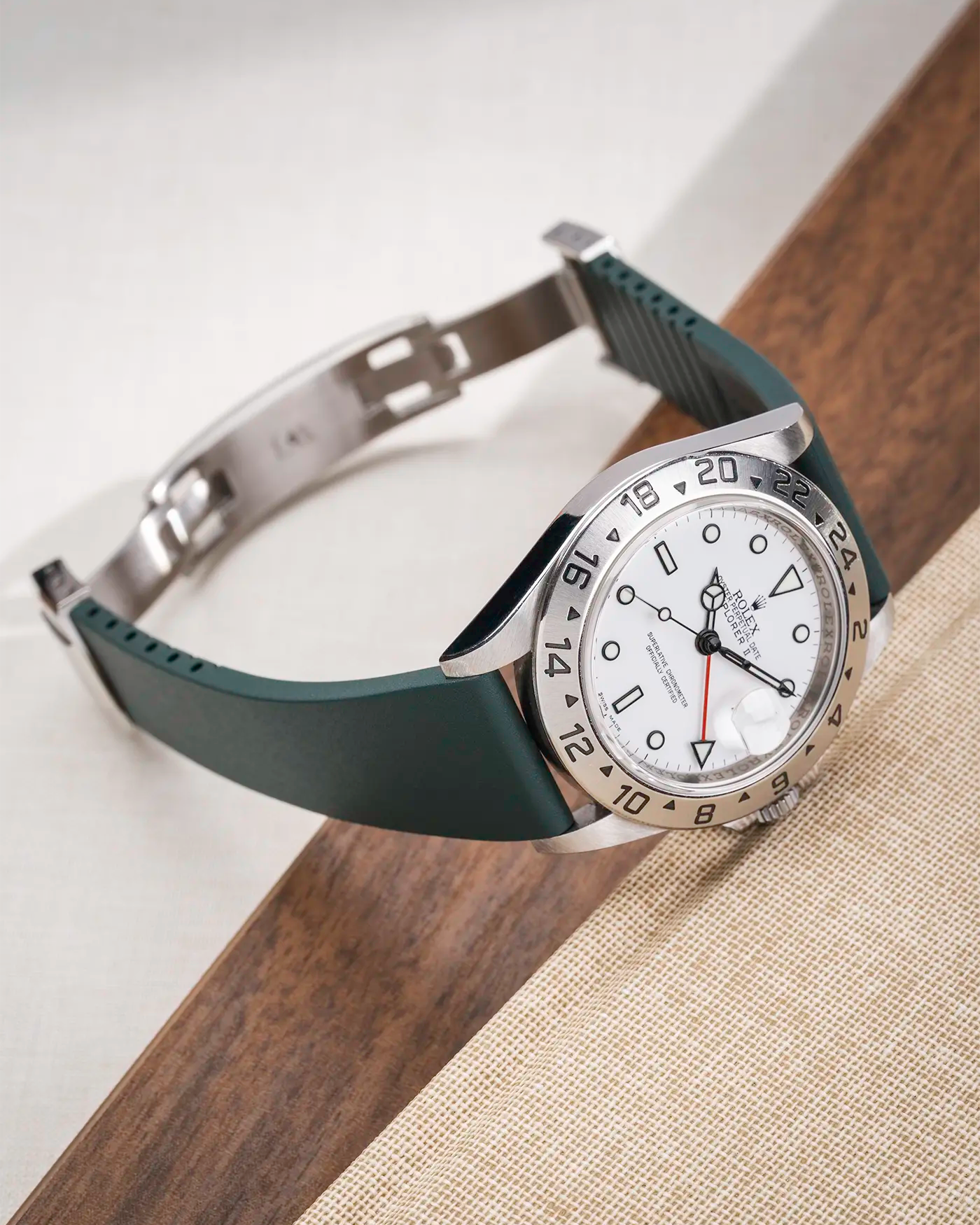 Green CTS FKM Rubber Strap 19-22mm lying flat and showing the clasp open