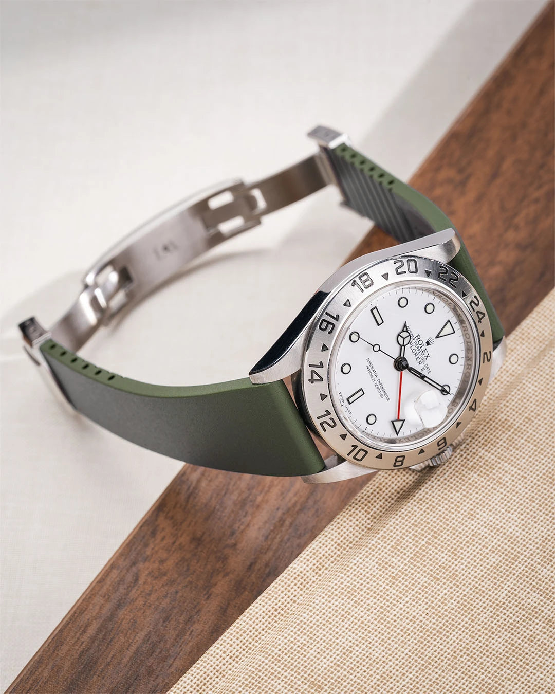 Green CTS FKM Rubber Strap 19-22mm lying flat and showing the clasp open