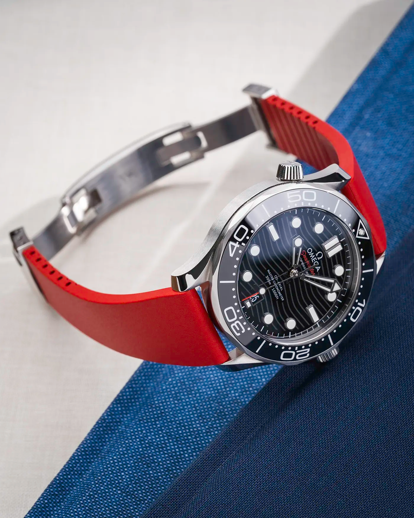 Red CTS FKM Rubber Strap 19-22mm lying on a table showing the strap's fit with the clasp open