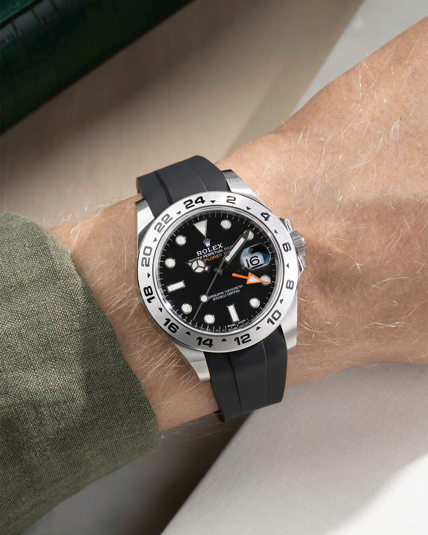 Wrist shot on black FKM Rubber Strap Integrated with Original Clasp - Rolex Explorer 216570 on beige background