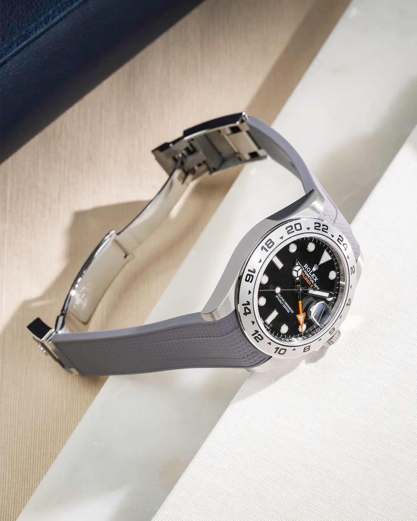 FKM rubber strap in Vertech integrated with original clasp for Rolex Explorer 216570 in grey, displayed on table with open clasp