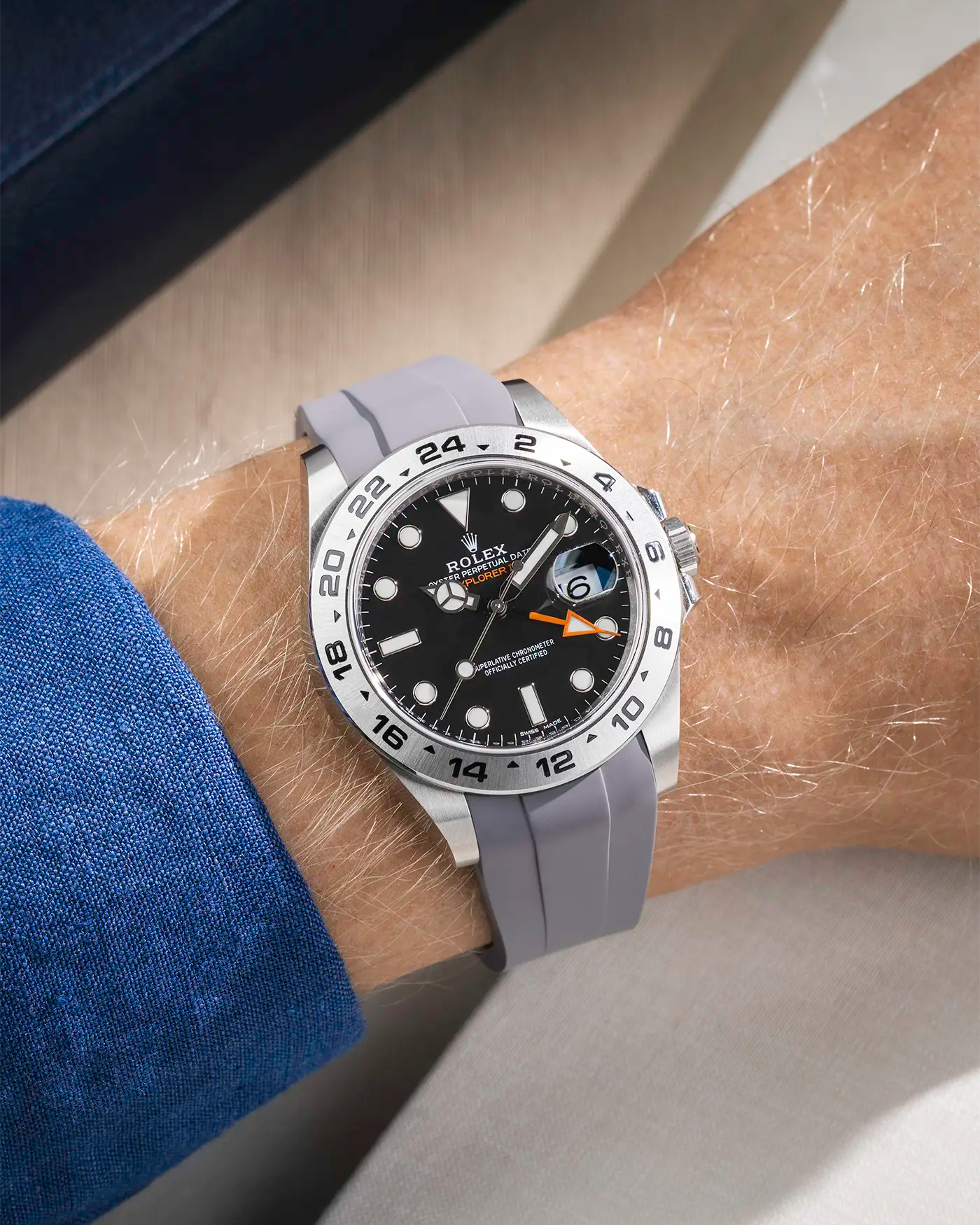 Wrist shot on grey FKM Rubber Strap Integrated with Original Clasp - Rolex Explorer 216570 on beige background