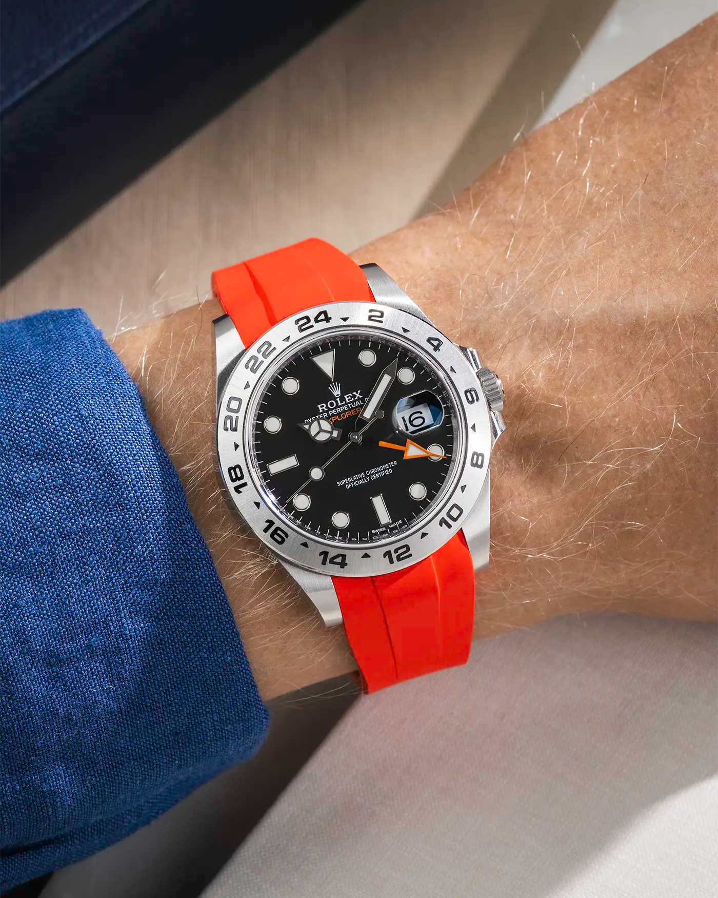 Wrist shot on Red FKM Rubber Strap Integrated with Original Clasp - Rolex Explorer 216570 on beige background