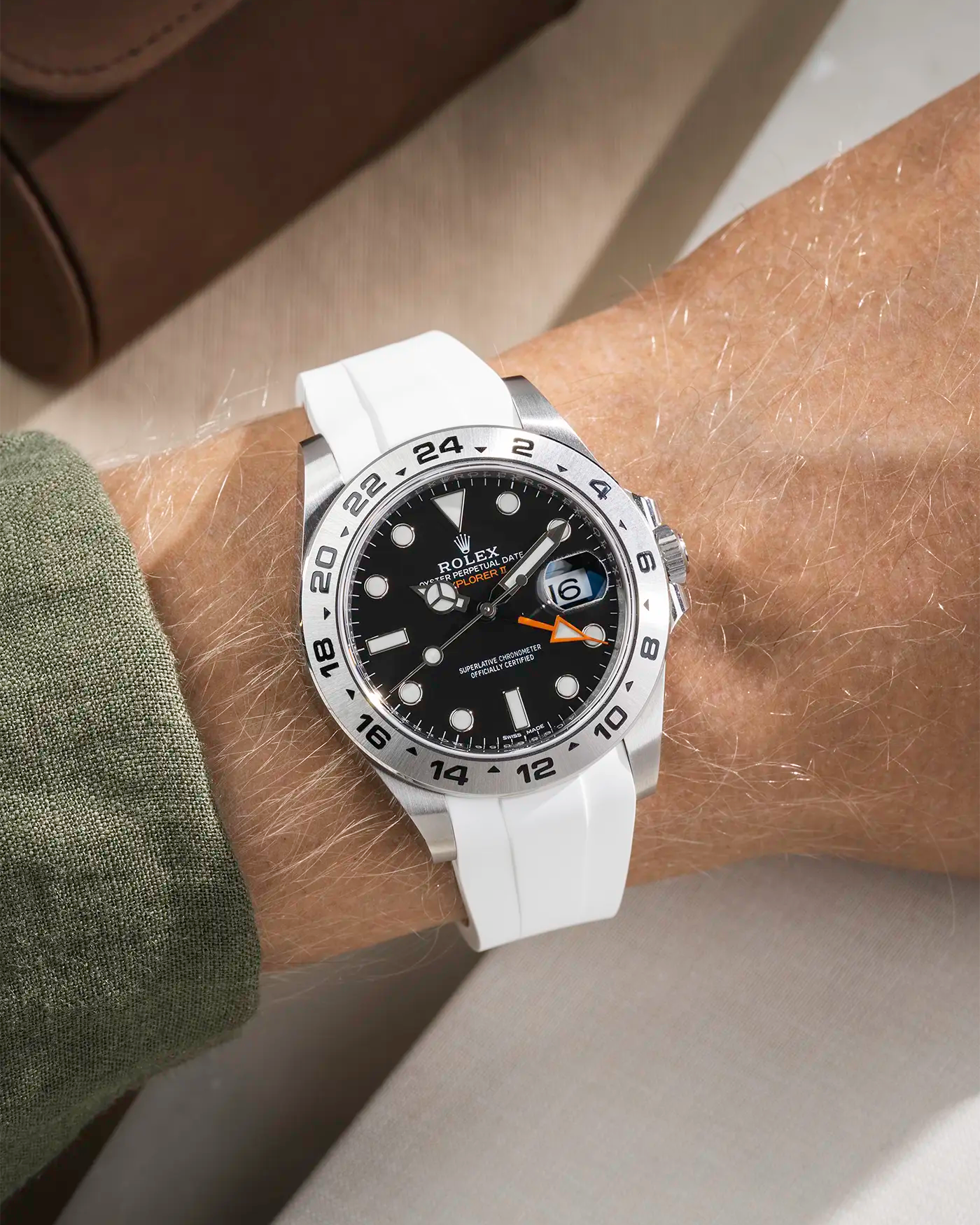 Wrist shot on White FKM Rubber Strap Integrated with Original Clasp - Rolex Explorer 216570 on beige background
