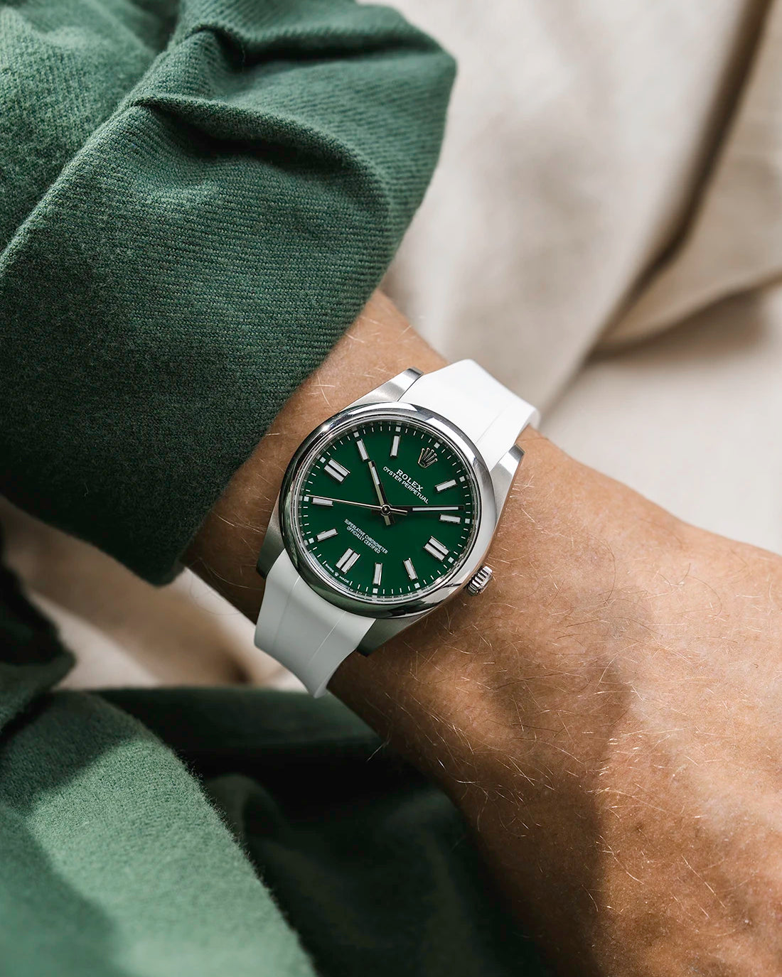 White integrated FKM rubber strap with original clasp on Rolex Oyster Perpetual 41 124300 green dial wrist shot