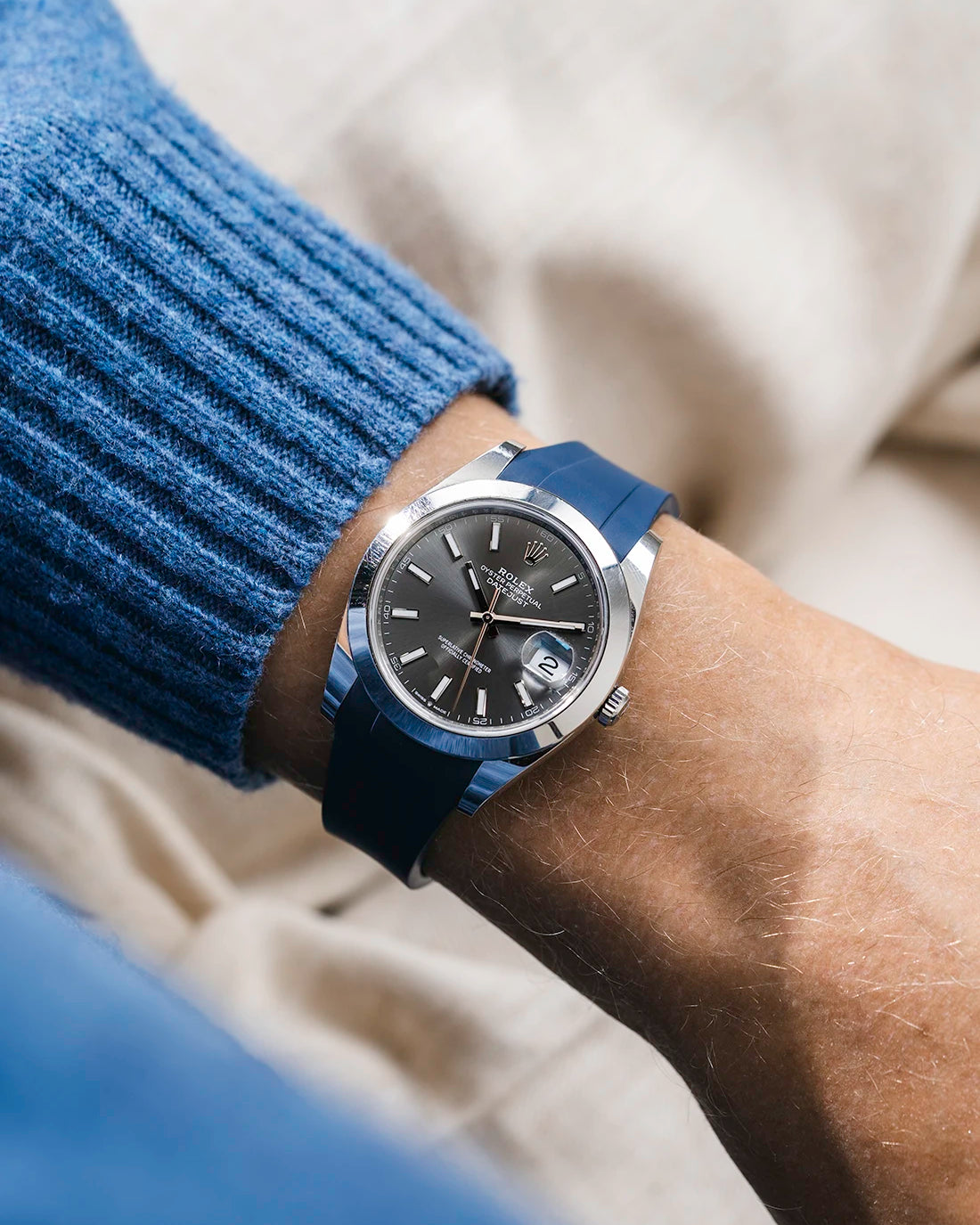 Navy blue integrated FKM rubber strap with original clasp on Rolex Datejust 41 126300 smooth bezel grey dial wrist shot