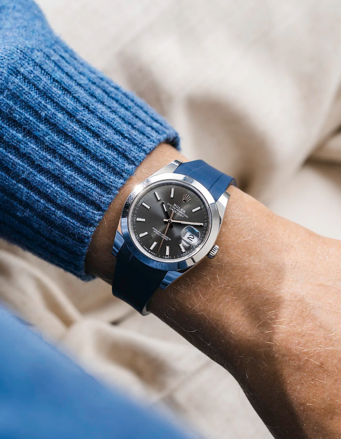 Navy blue integrated FKM rubber strap with original clasp on Rolex Datejust 41 126300 smooth bezel grey dial wrist shot