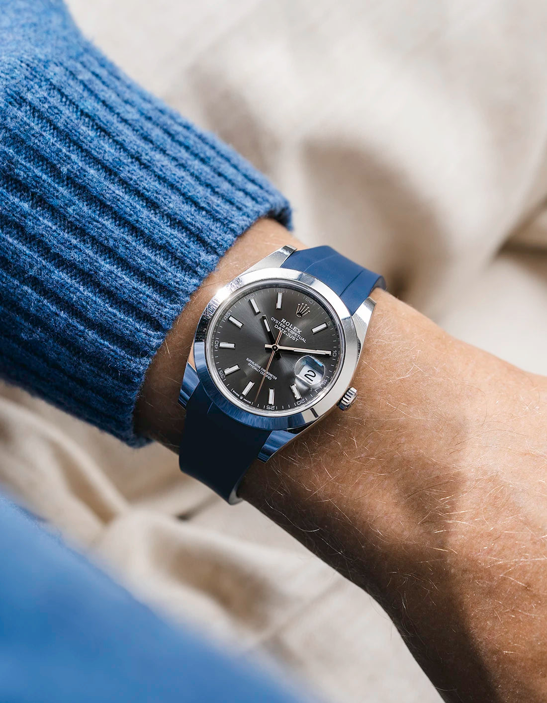 Navy blue integrated FKM rubber strap with original clasp on Rolex Datejust 41 126300 smooth bezel grey dial wrist shot