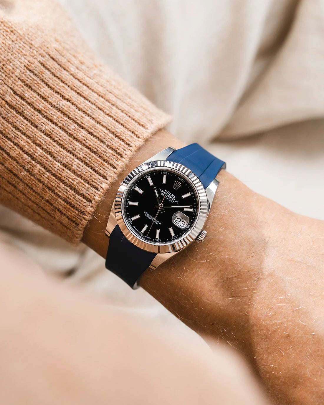 Navy blue integrated FKM rubber strap with original clasp on Rolex Datejust 41 126334 fluted bezel black dial wrist shot