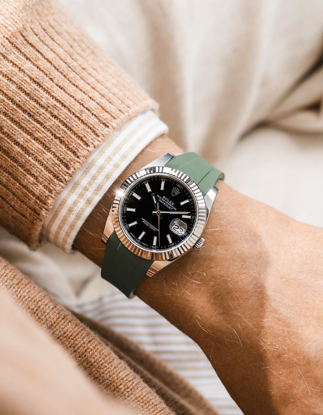 Green integrated FKM rubber strap with original clasp on Rolex Datejust 41 126334 fluted bezel black dial wrist shot