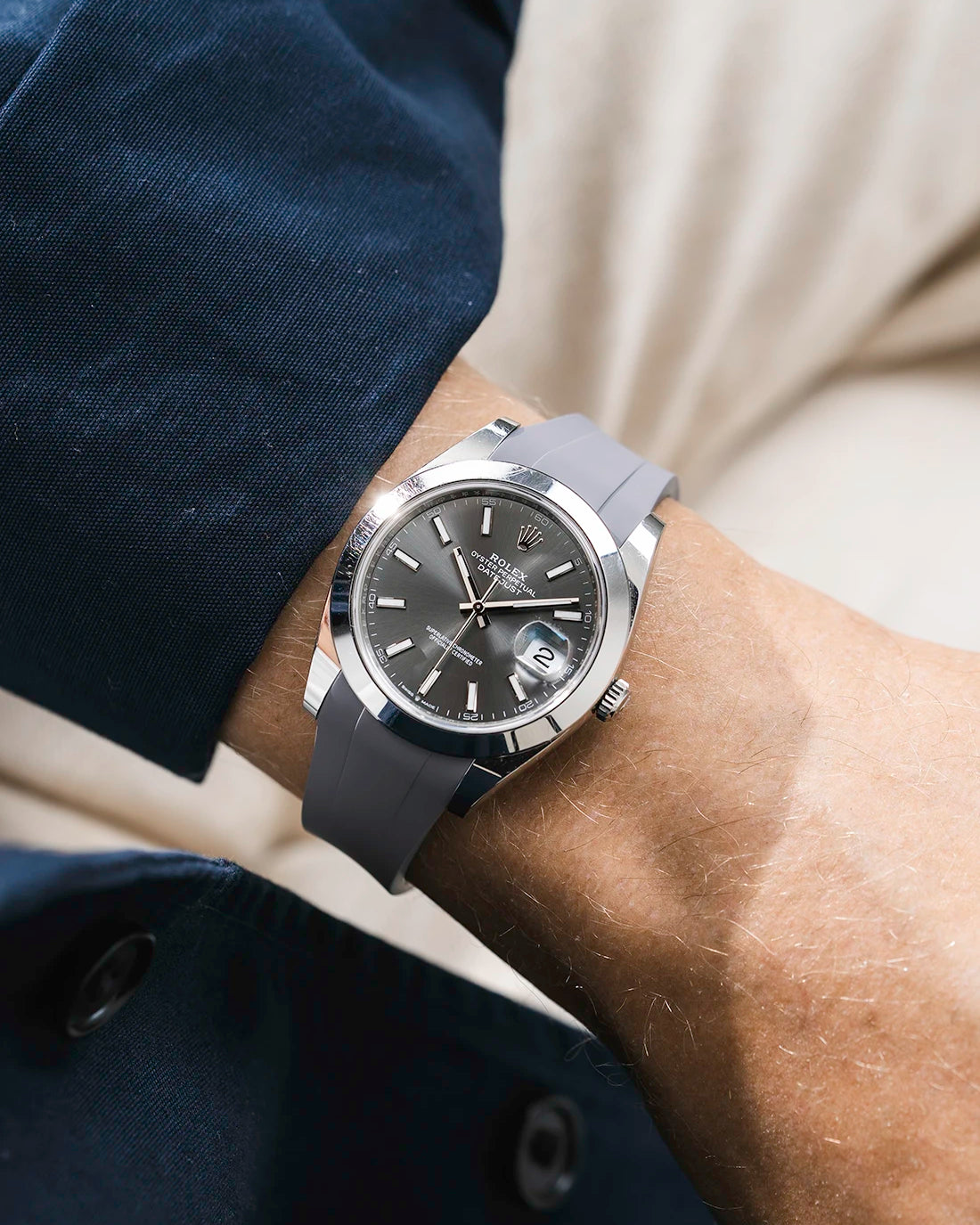 Grey integrated FKM rubber strap with original clasp on Rolex Datejust 41 126300 smooth bezel grey dial wrist shot