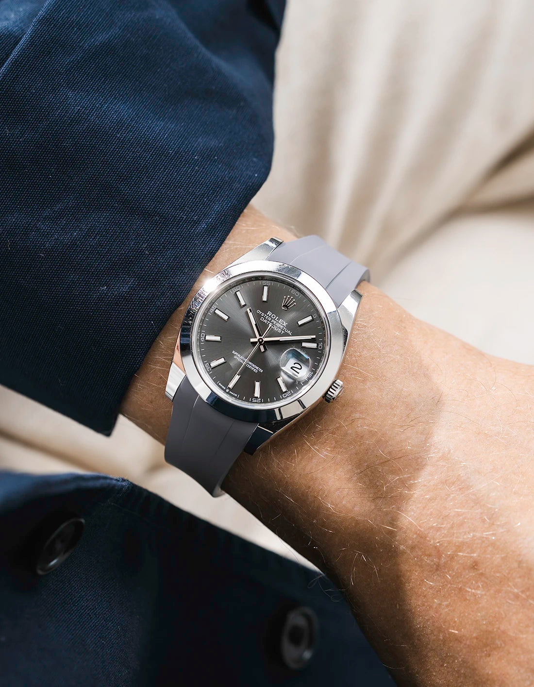 Grey integrated FKM rubber strap with original clasp on Rolex Datejust 41 126300 smooth bezel grey dial wrist shot