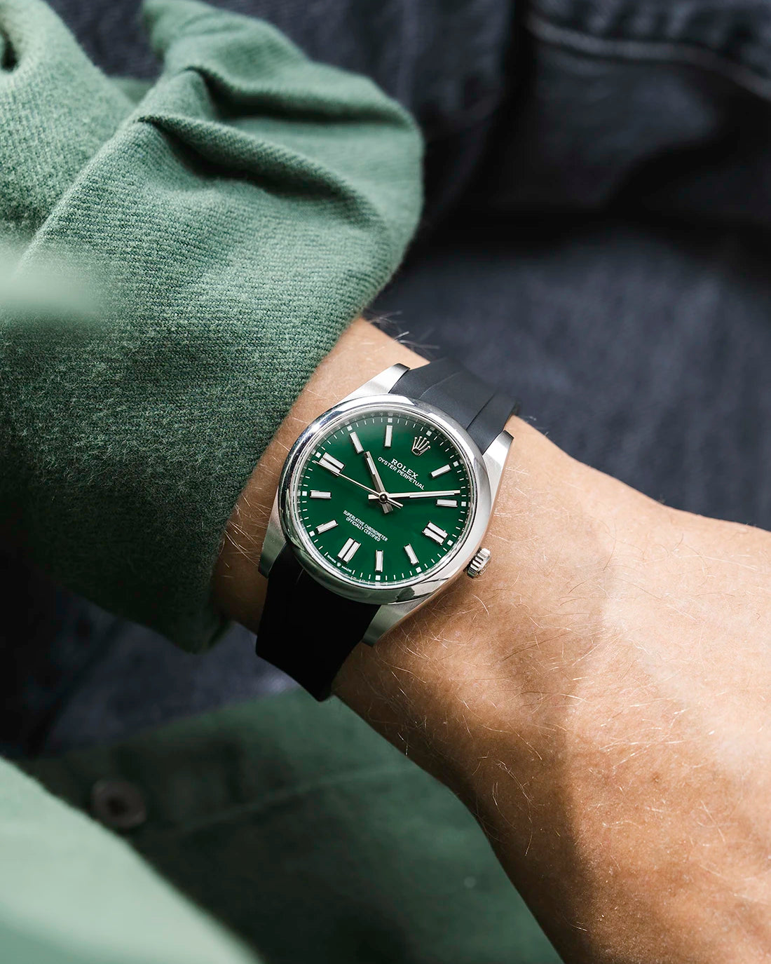 Black integrated FKM rubber strap with original clasp on Rolex Oyster Perpetual 41 124300 green dial wrist shot