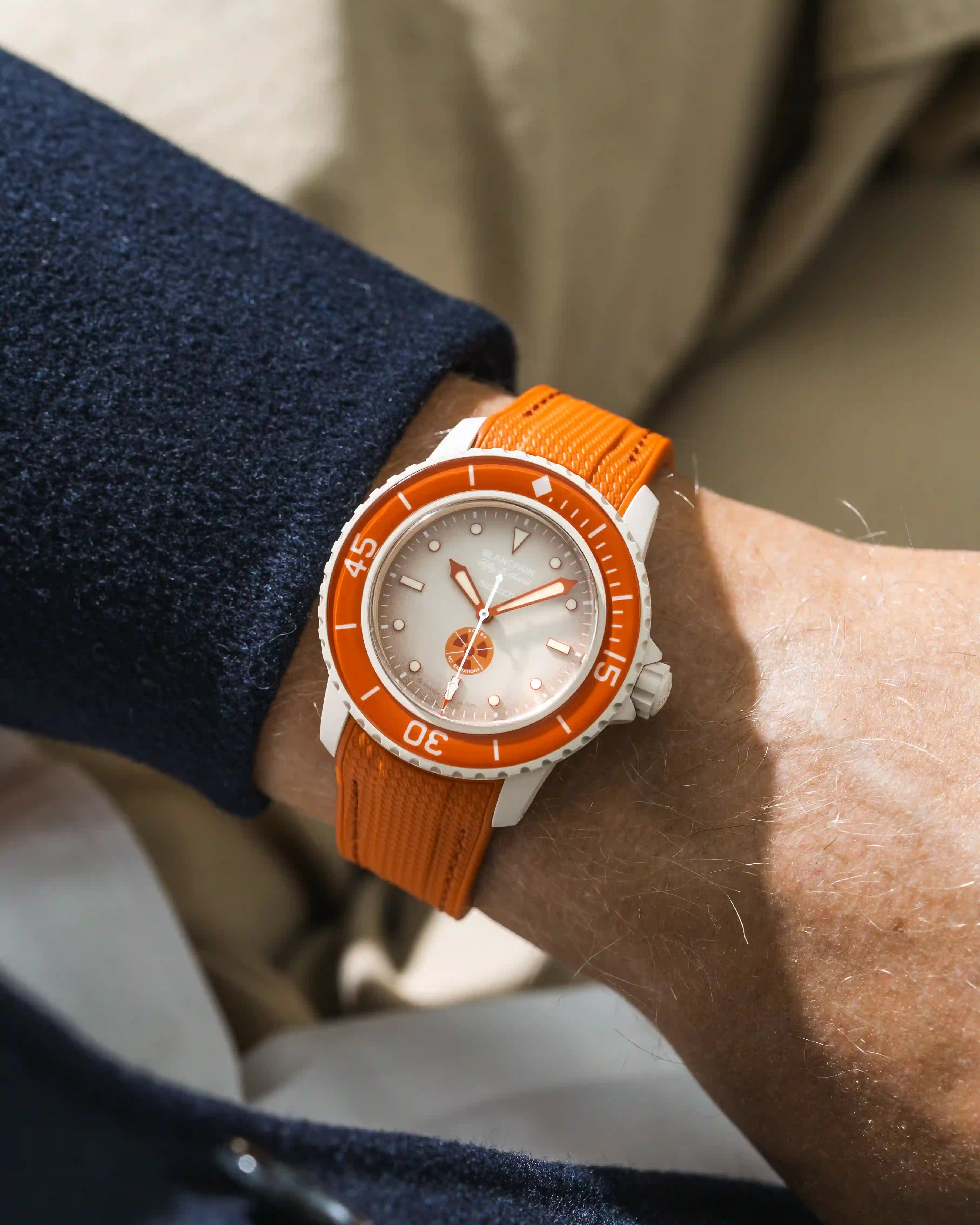 Arctic Red Rubber Strap on Blancpain X Swatch Arctic Ocean wrist shot with blue shirt