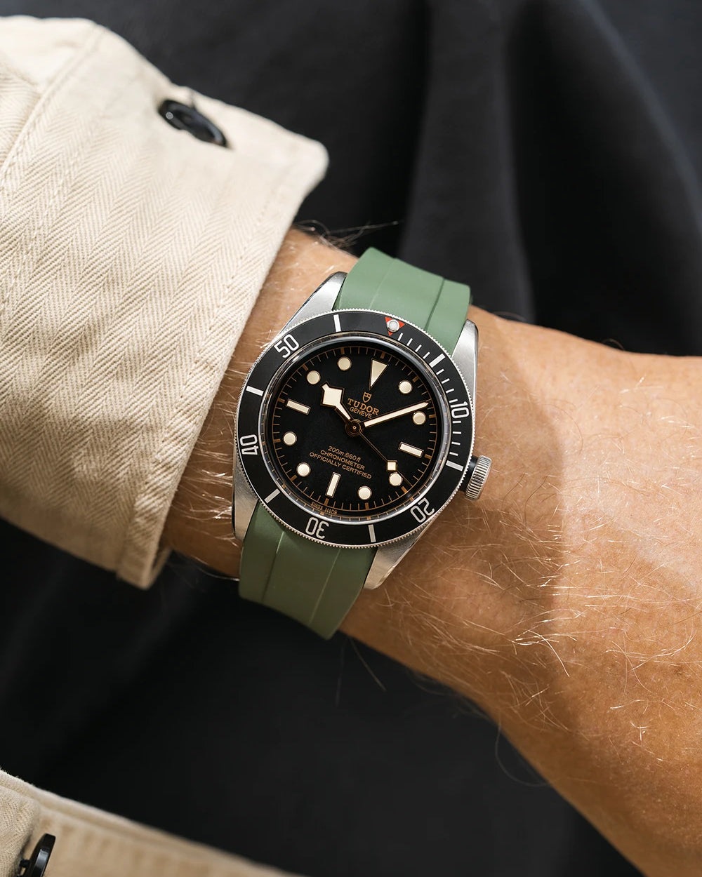 green FKM rubber watch strap from Wristbuddys with a Tudor BB41 Heritage black dial on a person's wrist