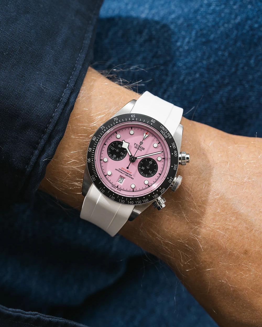 white FKM rubber watch strap from Wristbuddys with a Tudor Chrono pink dial on a person's wrist