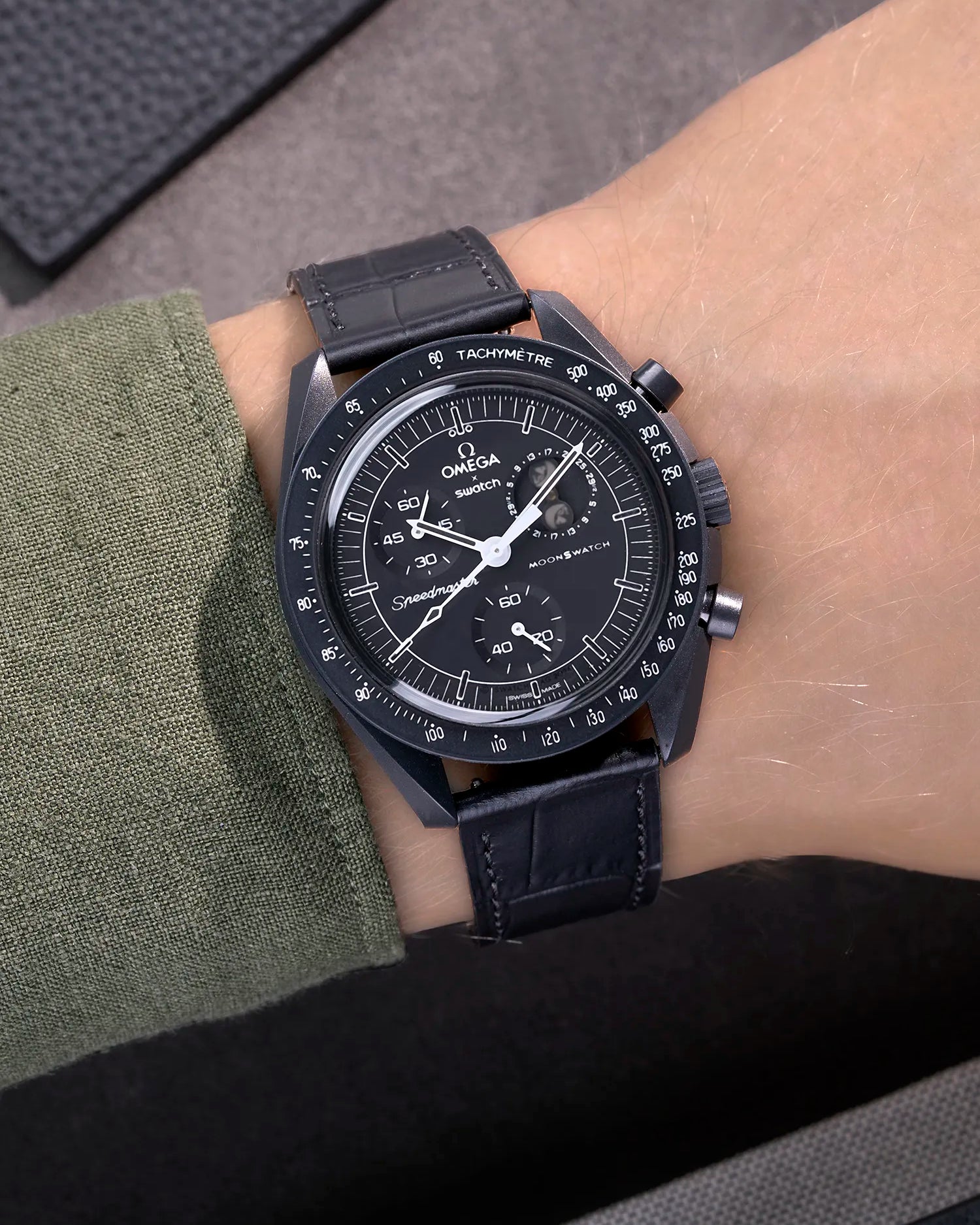 Black embossed alligator leather strap on Omega X Swatch MoonSwatch Mission to the Moonphase New Moon – wrist shot