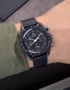 Black embossed alligator leather strap on Omega X Swatch MoonSwatch Mission to the Moonphase New Moon – wrist shot