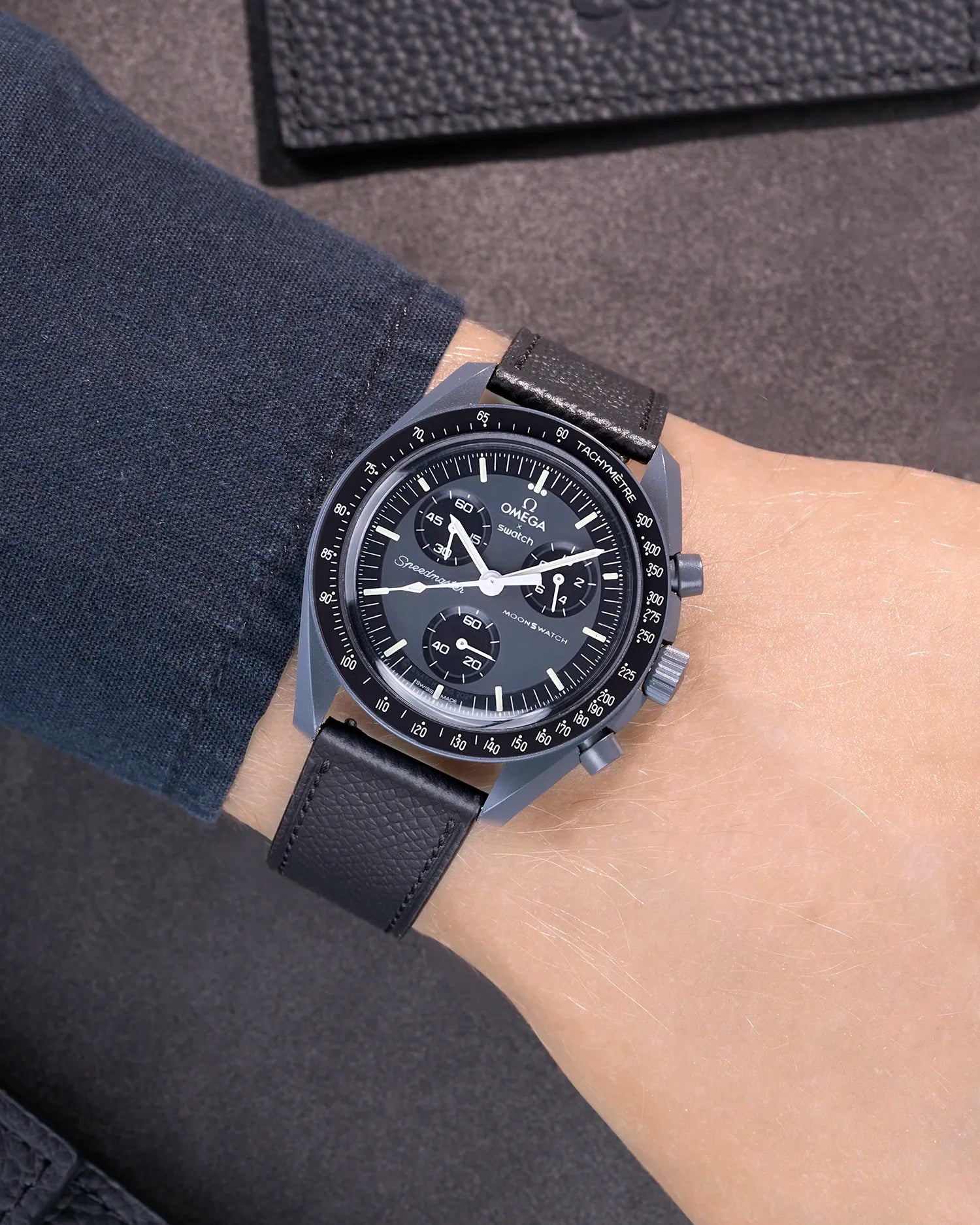 Black Epsom leather strap on Omega X Swatch MoonSwatch Mission to Mercury - worn on wrist
