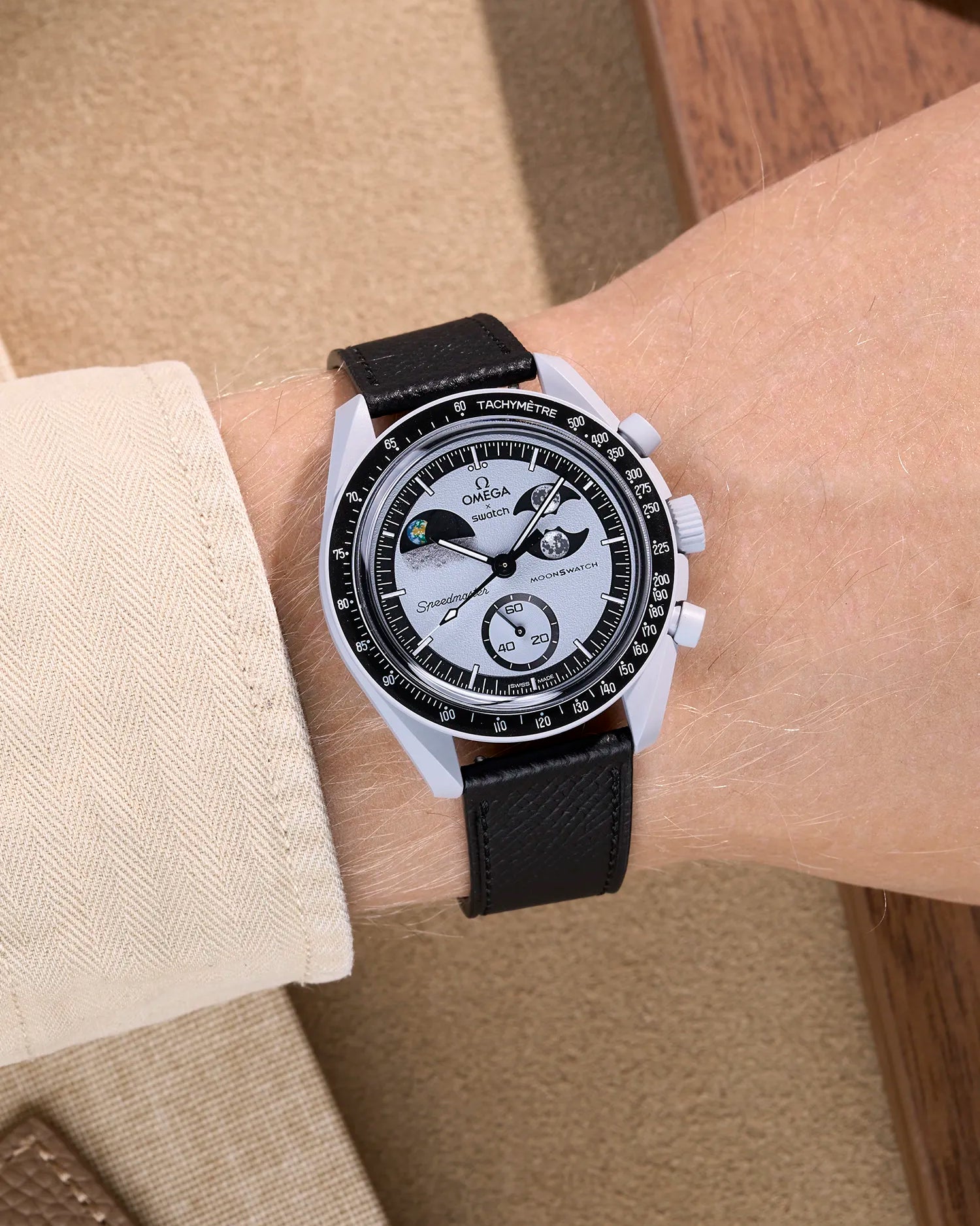 Black Epsom leather strap on Omega X Swatch MoonSwatch Mission to Earthphase worn on wrist