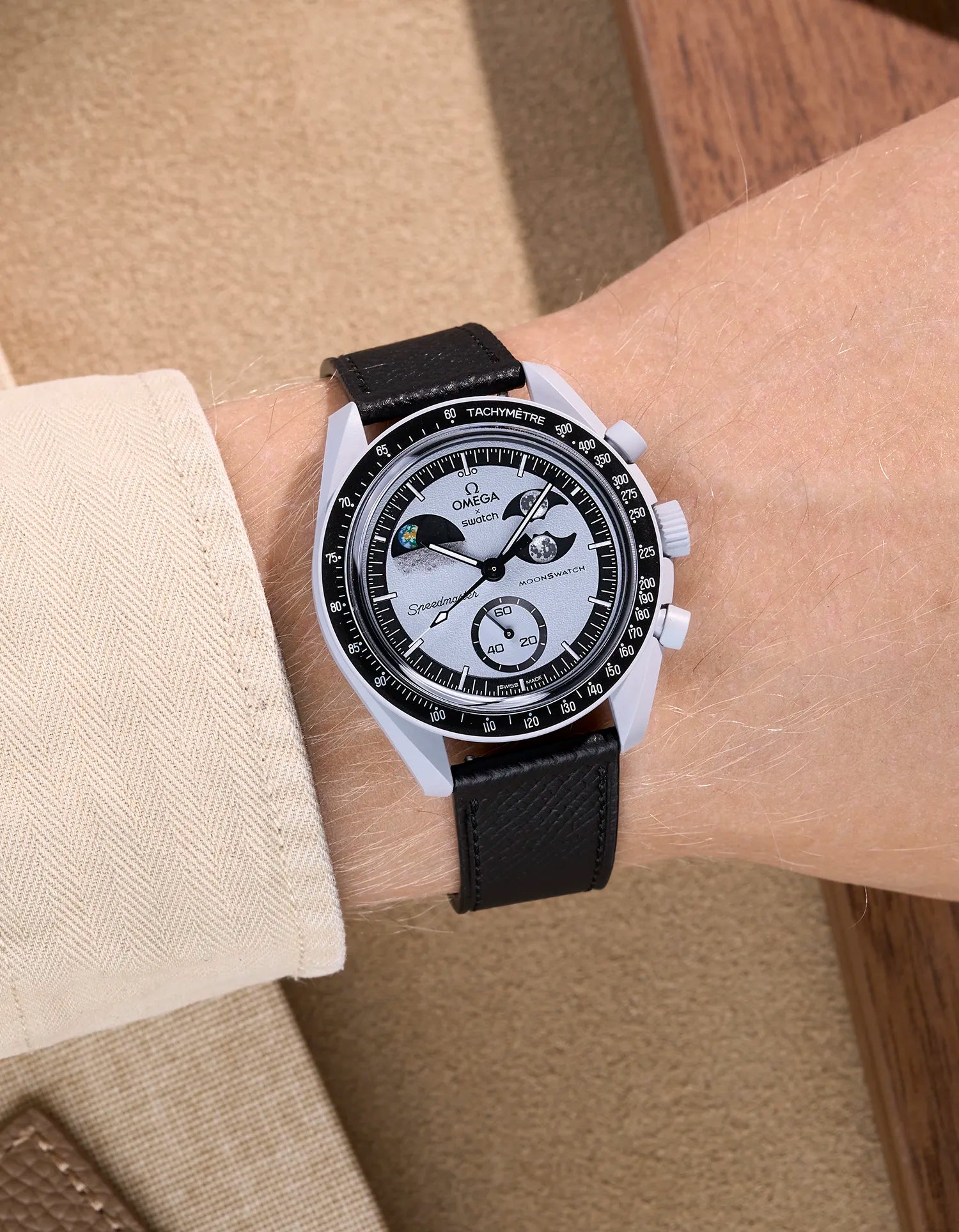 Black Epsom leather strap on Omega X Swatch MoonSwatch Mission to Earthphase worn on wrist