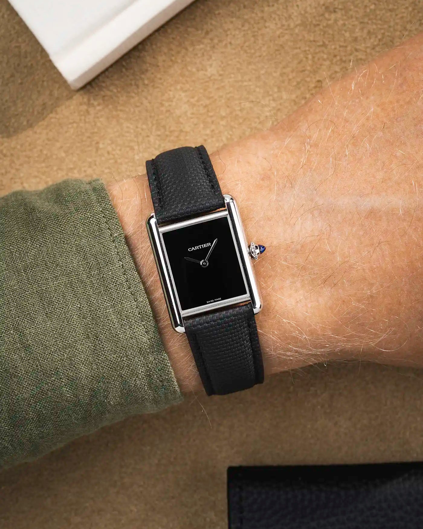 Black rubberised sailcloth strap on Cartier Tank Must with black dial – sleek look for formal watches