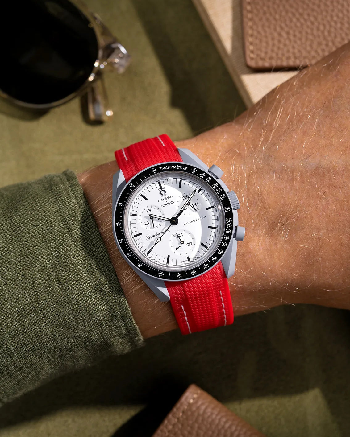 Curved red rubber strap for MoonSwatch – shown on Omega X Swatch Mission to 1965