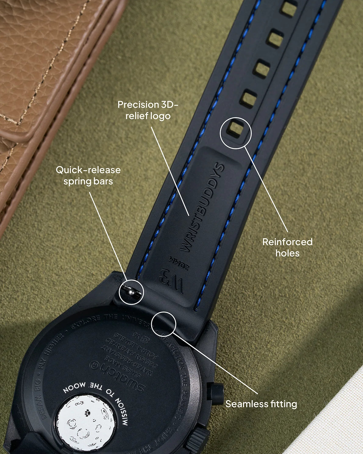 Black curved rubber strap with blue stitching, 3D-relief Wristbuddys logo, quick-release spring bars and reinforced holes