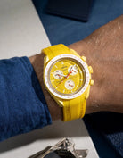 yellow curved vertech rubber strap on MoonSwatch Mission to the Sun wrist shot