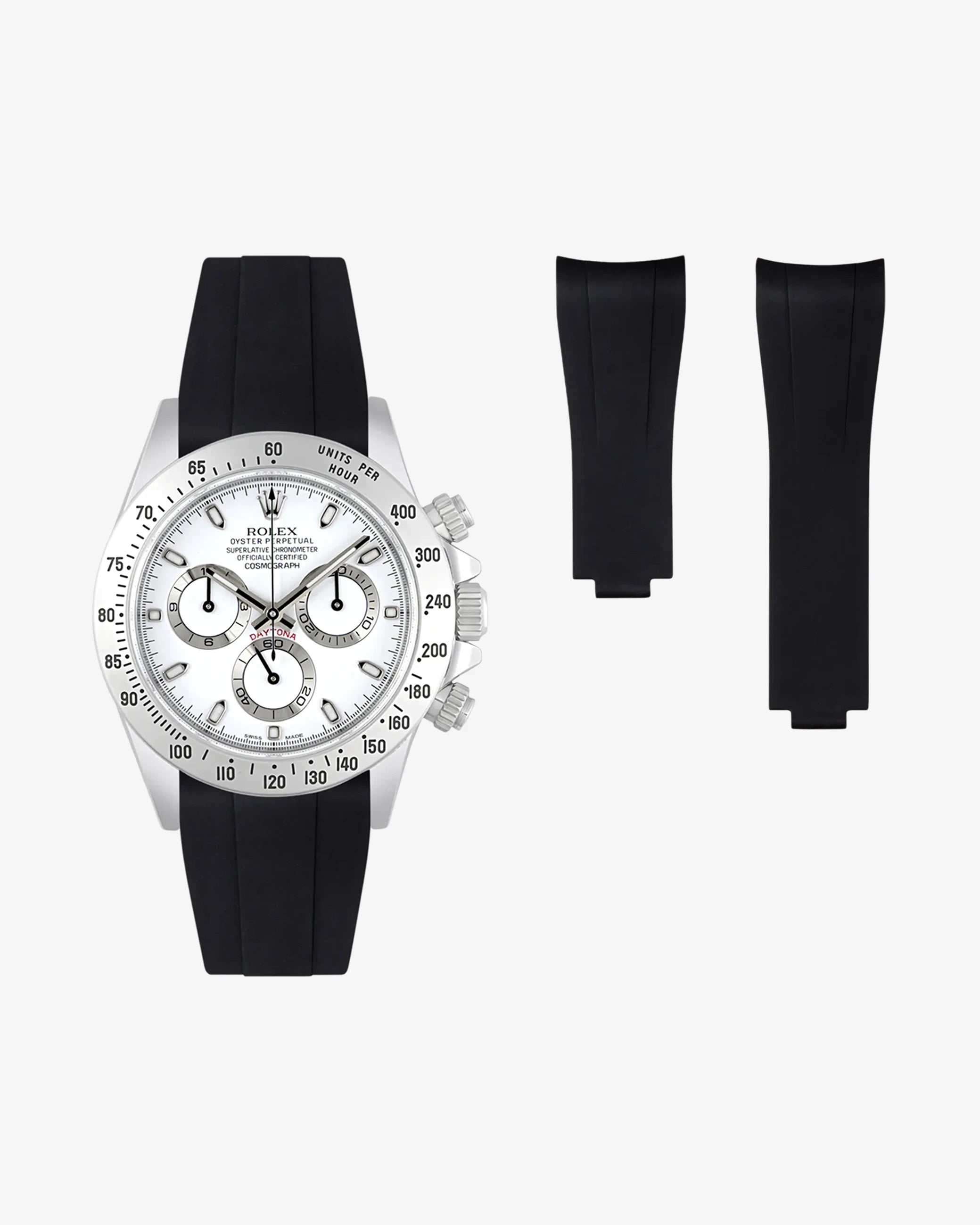 Black FKM rubber strap mounted on a Rolex Daytona 116520 with white dial, including extra strap pieces on the side.