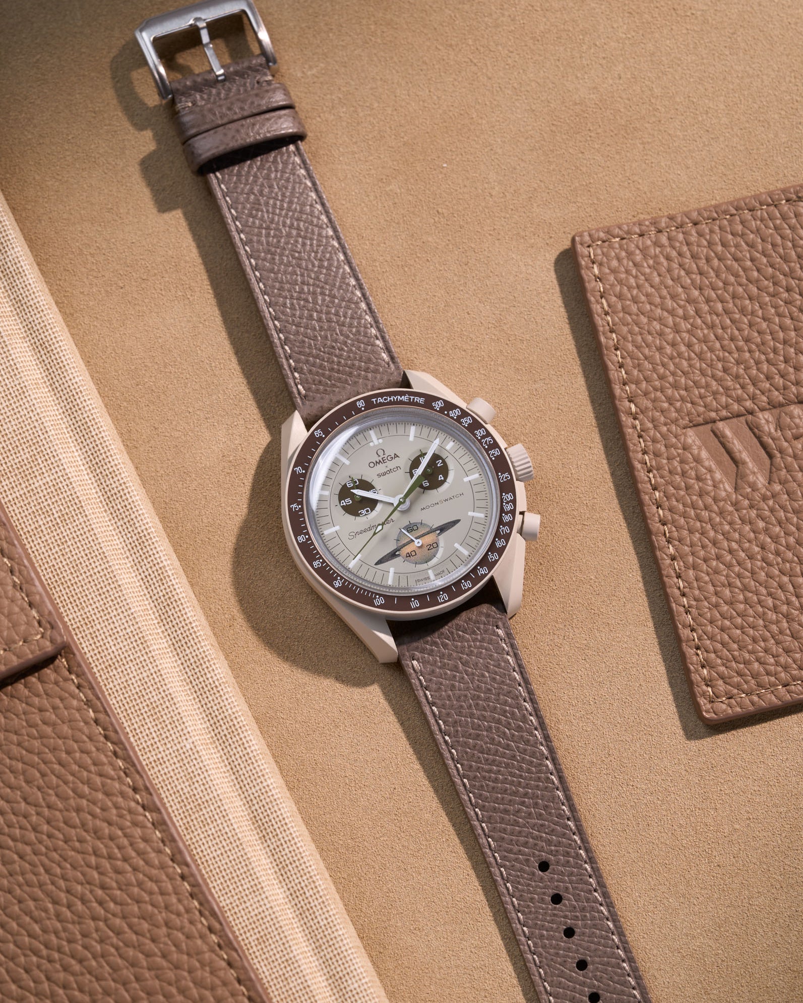 Flat lay of grey Epsom leather strap for Omega x Swatch MoonSwatch Mission to Saturn