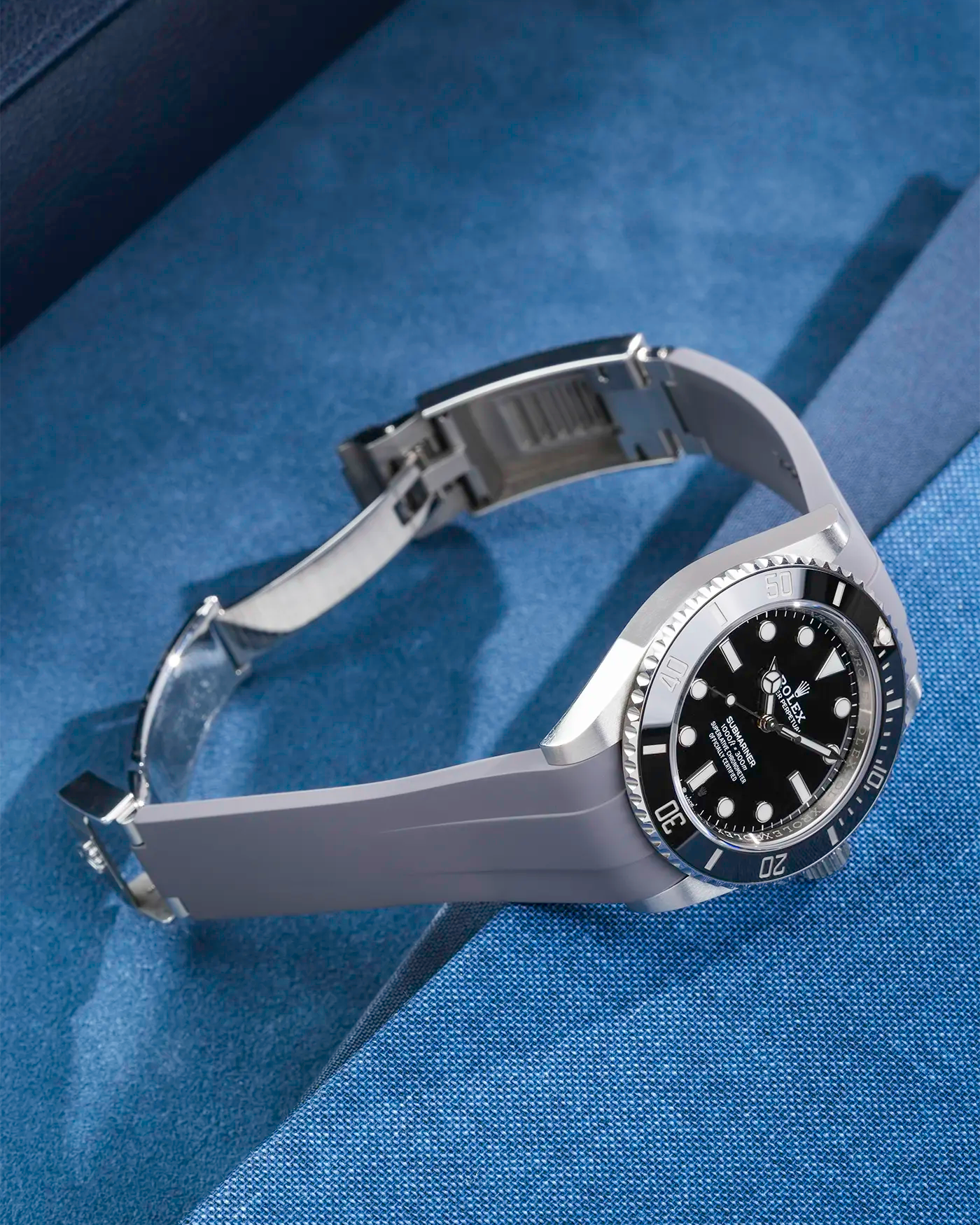 Rolex Submariner 41 fitted with grey Classic Smooth FKM Rubber Strap sitting on the watch, integrated with original clasp – side angle product photo showing clasp open