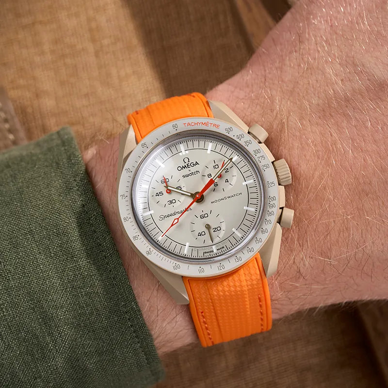 Omega X Swatch MoonSwatch Mission to Jupiter with an orange strap from Wristbuddys, showcasing a bold and stylish design.