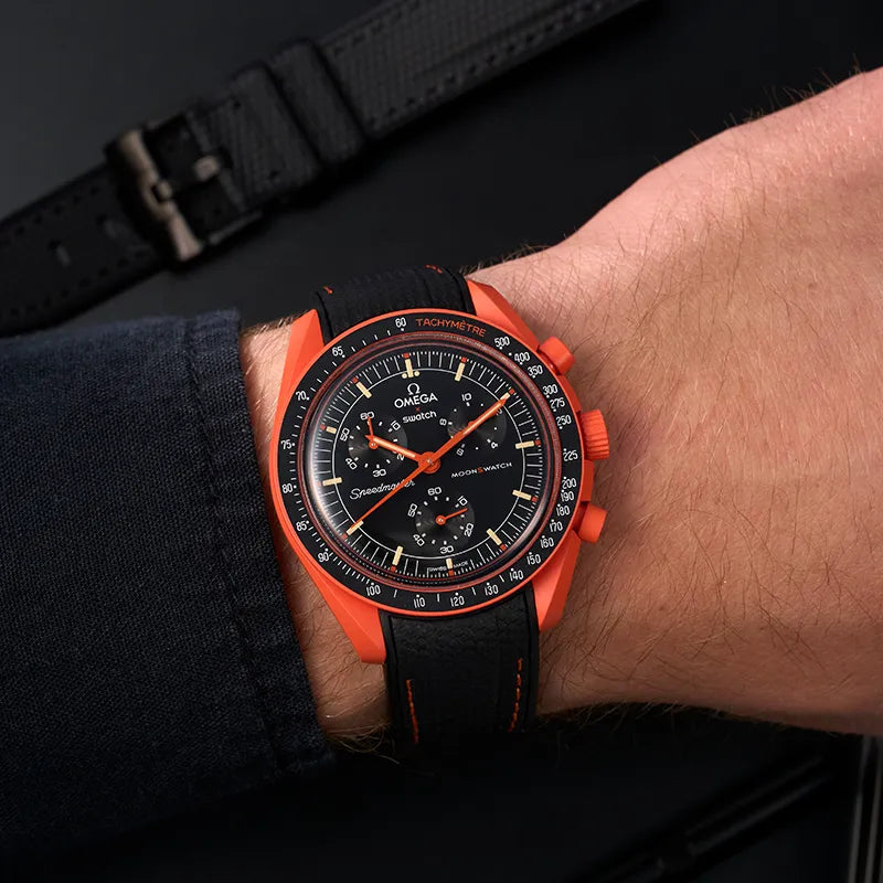 Omega X Swatch MoonSwatch Mission with a premium orange rubber strap from wristbuddys.com, combining style and durability.