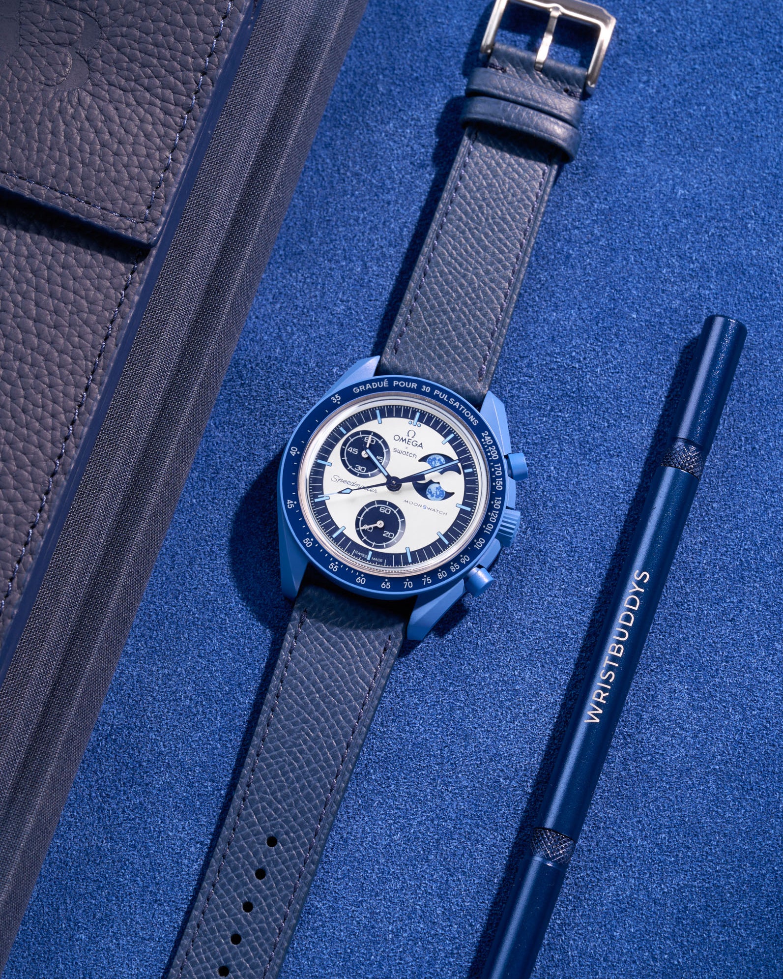 Flat lay of Dark Blue Epsom leather strap on Omega X Swatch Mission to Super Blue Moonphase