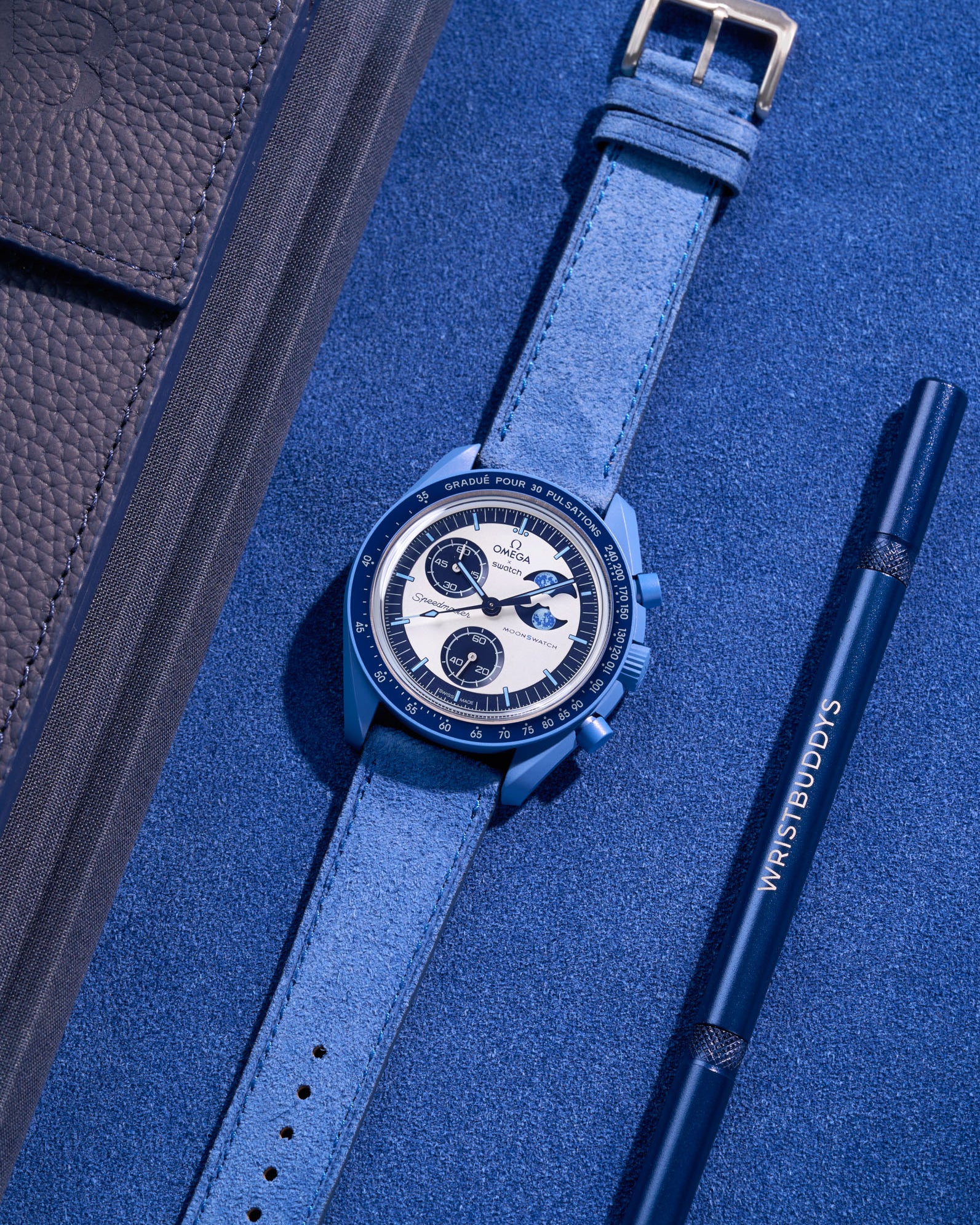 Flat lay of Ocean Blue suede leather strap for Omega X Swatch Super Blue Moonphase