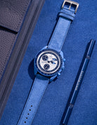 Flat lay of Ocean Blue suede leather strap for Omega X Swatch Super Blue Moonphase
