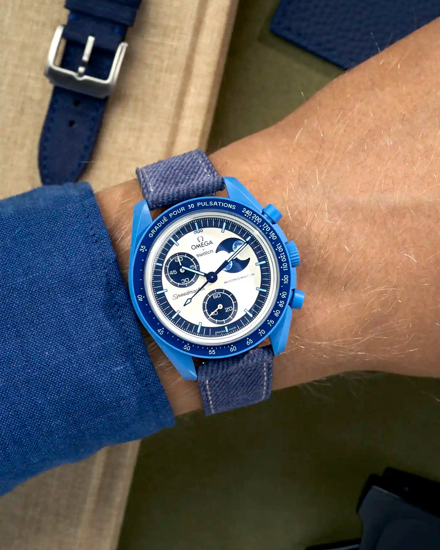 Light Blue & White Stitches Denim strap on Omega x Swatch Mission to Super Blue Moonphase wrist shot