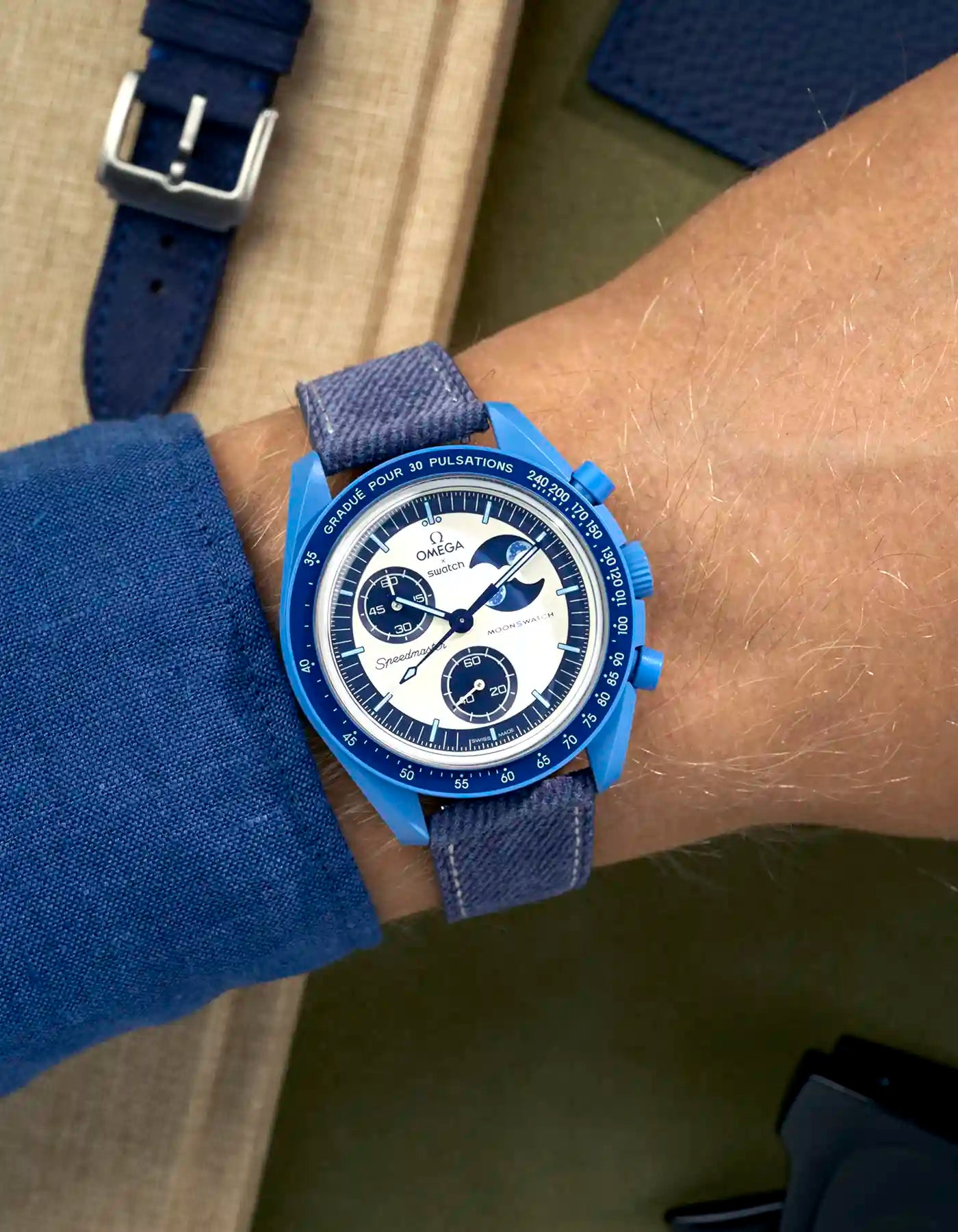 Light Blue & White Stitches Denim strap on Omega x Swatch Mission to Super Blue Moonphase wrist shot