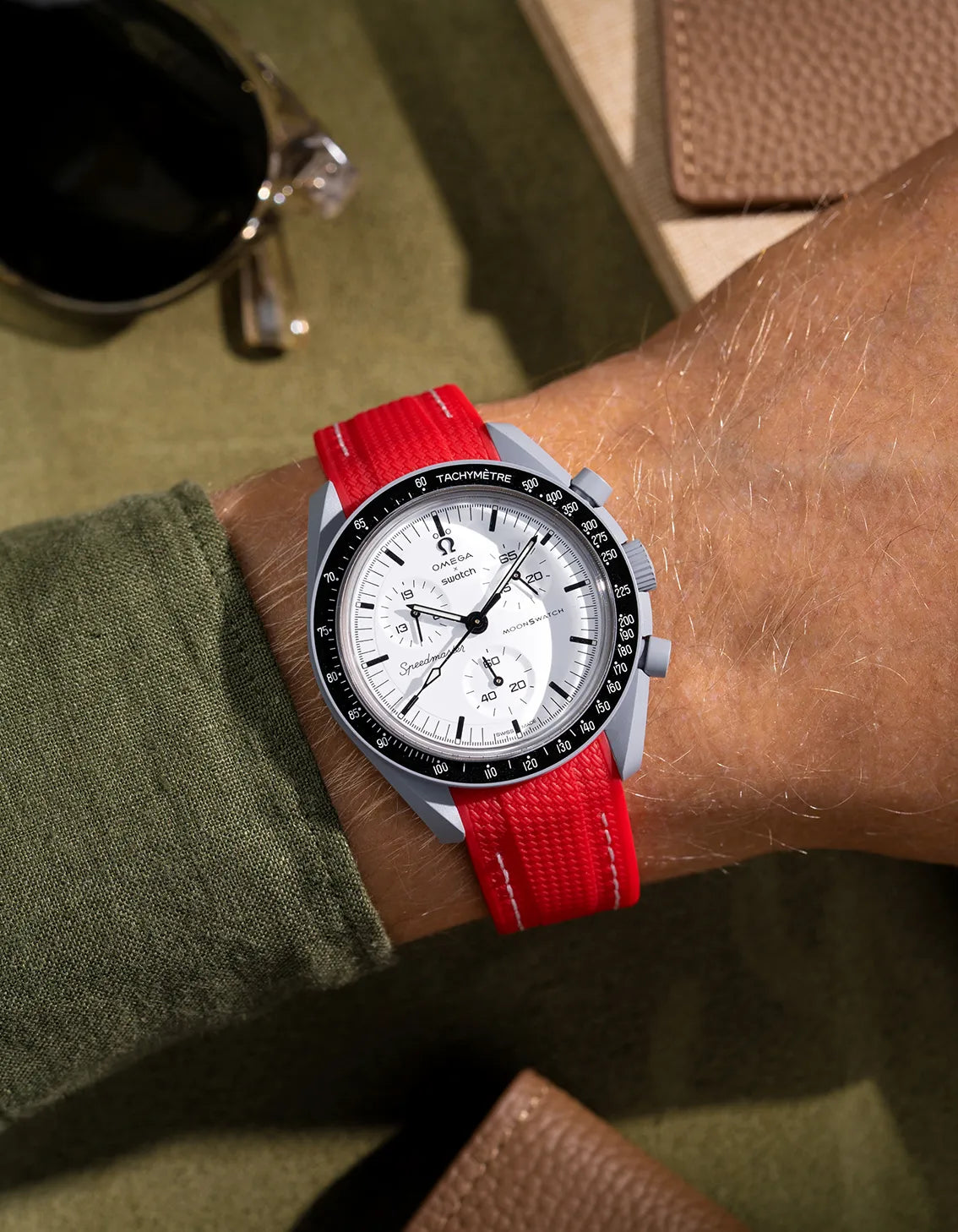 Red Vertech rubber strap custom-made for Omega MoonSwatch Mission to 1965, styled on wrist with white dial and black bezel