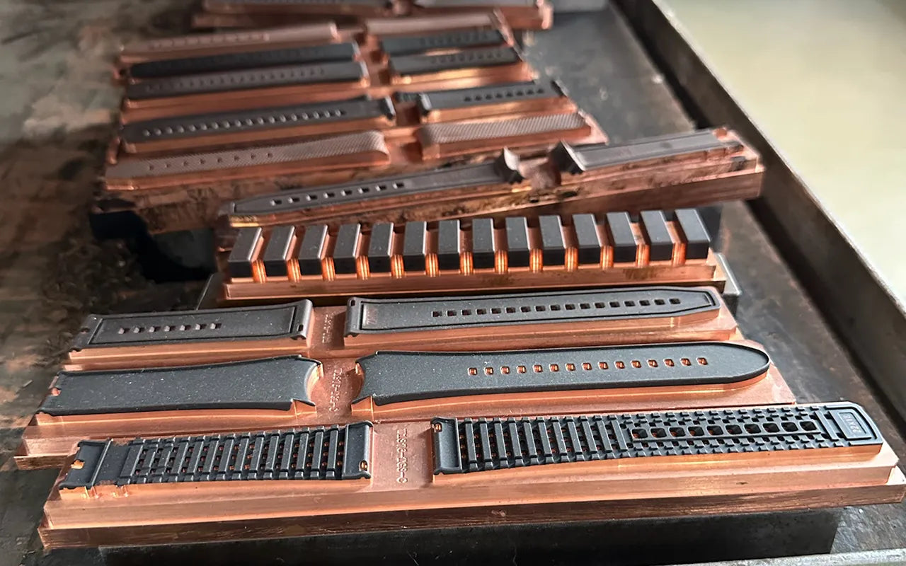 Hardened steel molds used in Wristbuddys rubber watch strap production to ensure consistent shape and texture at scale