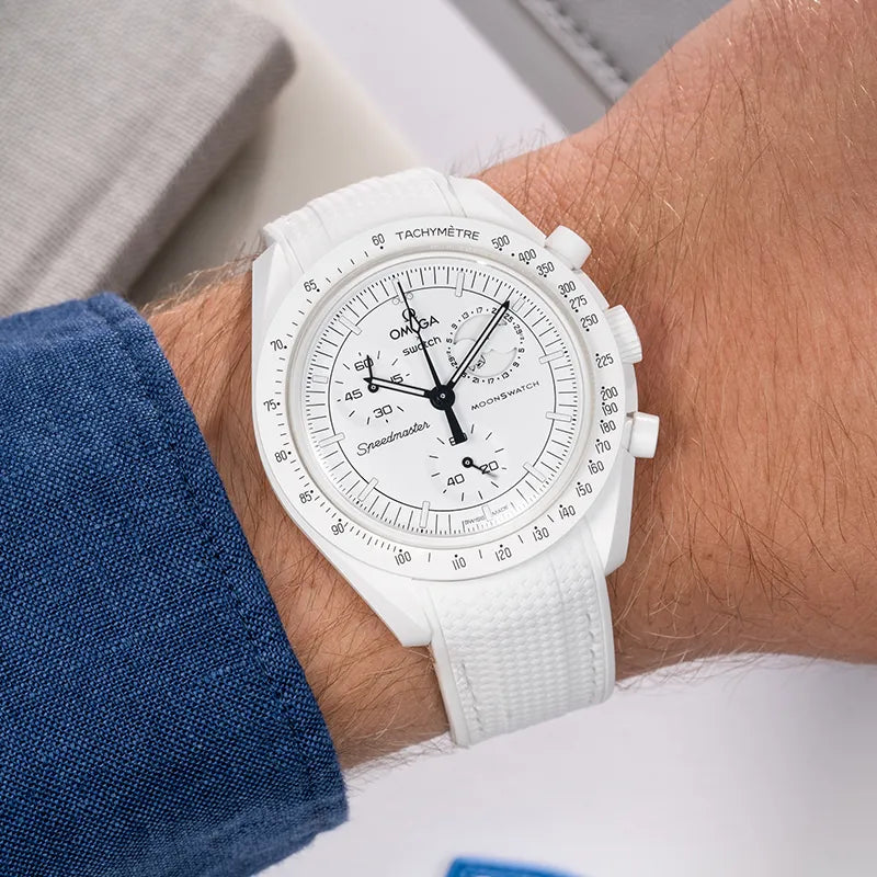 Omega X Swatch MoonSwatch Mission to the Moonphase watch featuring a clean white rubber strap from wristbuddys. Showcasing a sleek and modern design, this strap complements the watch's bold look and ensures a comfortable fit for all wrists.